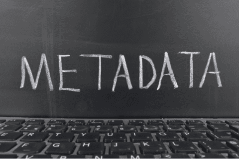 Image of meta data written on a blackboard with a keyboard at the bottom