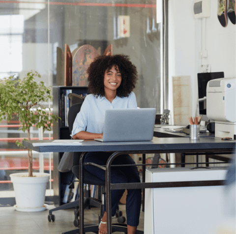 image of lady sitting at computer for web design content